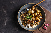 White mushrooms in a garlic-cream sauce with roasted young potatoes