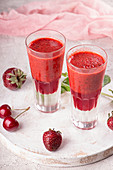 Summer blended strawberry smoothie juice in glasses