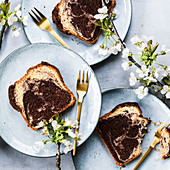 Several pieces of marble cake on plates