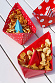 Snacks served in handmade paper boats