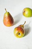 Wet pears on a white background