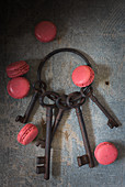 Still life with a rusty keychain and macarons