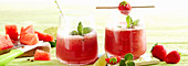 Frosted watermelon strawberry mojito with mint and lime