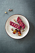 Lokum with pomegranate syrup, pistachio nuts and rose petals (Levant cuisine)