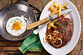 Bistec a lo Pobre (beef steak with chips, onions and fried egg, Chile)