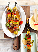 Grilled beef and pineapple skewers with macadamia nut and chilli sauce