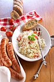 Texas coleslaw with grilled red sausage and wholemeal baguette