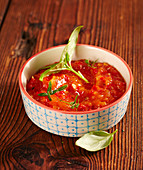 Fiery-spicy tomato sauce as a dip for a fondue