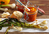 Calcotada a la riba: grilled spring onions with a pepper and wine sauce and baguette