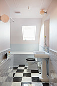 Classic bathroom with vintage-style sink and chequered floor