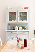 View of dresser across old wooden table