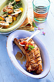 Grilled spare ribs with vegetable skewers and a tomato dip