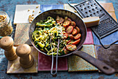 Zucchini noodles with tomatoes and pine nuts