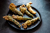 Young courgette with flowers in tempura batter