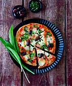 Pizza with olives and wild garlic