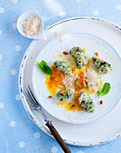 Spinach malfatti with pumpkin butter and Parmesan cheese