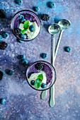 Blackberry and blueberry smoothie with cream ice cream and fresh mint