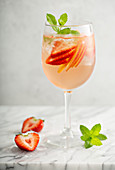 Summer white sangria with strawberries and peaches