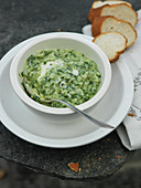 Wild garlic risotto in a porcelain bowl