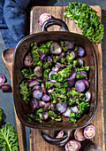 Baked purple potatoes with kale