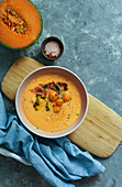 Orange melon cold soup, with jamon, typical spanish dish