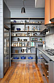 Storage shelf in gray in the masculine kitchen with wooden floor