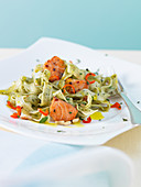 Herb tagliatelle with salmon, chilli and pine nuts