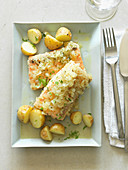 Salmon fillet with a vegetable crust and roast potatoes