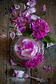 Pink roses and sugar in screw-top jar