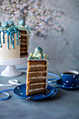 Coffee giotto cake with blue chocolate drips and sugar pearls