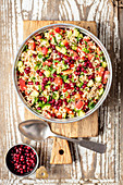Tabbouleh with tomato, cucumber and pomegranate seeds