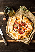 Galette with tomatoes, mozzarella and herbs