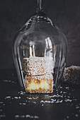 Lamingtons – coconut sponge cakes under a wine glass