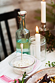 Candles and food on table