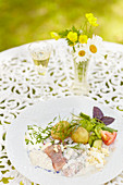 Herring with potatoes, chive sauce and salad