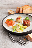 Mediterranean vegetable salad with marinated salmon, tuna fish and scallops