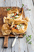 Mediterranean potato and vegetable parcels with feta cheese