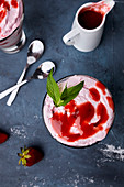 Strawberry mousse in a glass with strawberry sauce