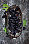 Blackberries in a rusty shell