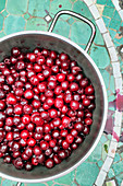 Stoned cherries in a pot