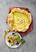 Filo pastry quiche with feta cheese served with a cucumber and melon salad