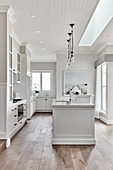 Island counter in white kitchen