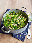 Punchy spring greens with anchovies and hazelnuts