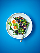 Soft-boiled eggs with black rice and aubergine