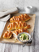 Sausage rolls with an onion dip