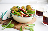 Dill potatoes with sugar peas and pork belly