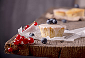 Muffin with blueberries, raspberries and red currants