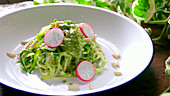 Prepare Zucchini spaghetti with pesto