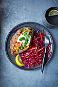 Baked sweet potato with lentils and red cabbage slaw