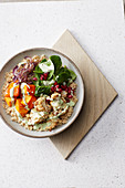 Pumpkin and couscous bowl with avocado and yoghurt